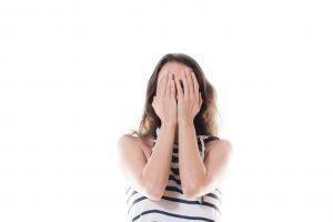 Woman Covering Face With Hands Against White Background face palm, d'oh, sad, embarrass, diverse, stress